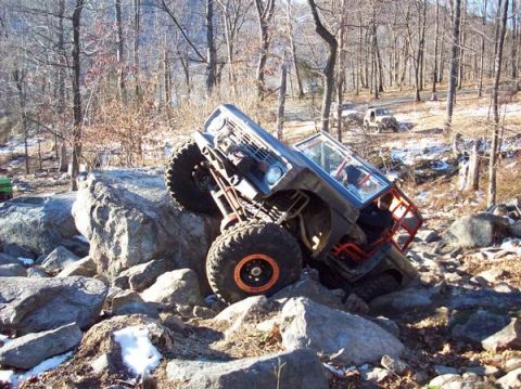 1978 Ford Bronco - This modified 1978 Ford Bronco navigates a challenging rocky terrain, its off-road capabilities.