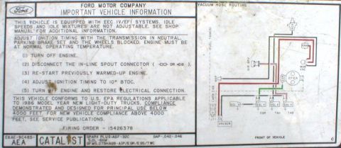 1986 Ford Bronco - This decal provides important vehicle information and a vacuum hose routing diagram, referencing 1986 model year compliance.