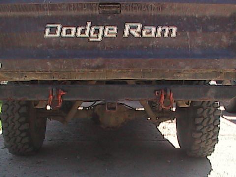 1980 Dodge Magnum - Rear view of a Dodge Ram pickup truck showing the tailgate, tow hitch, and tires.
