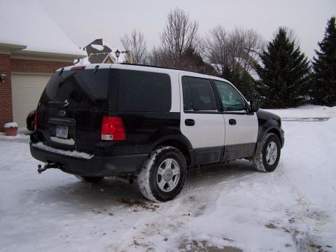 2004 Ford Expedition - Two-tone Ford Expedition seen in a snowy driveway during winter.