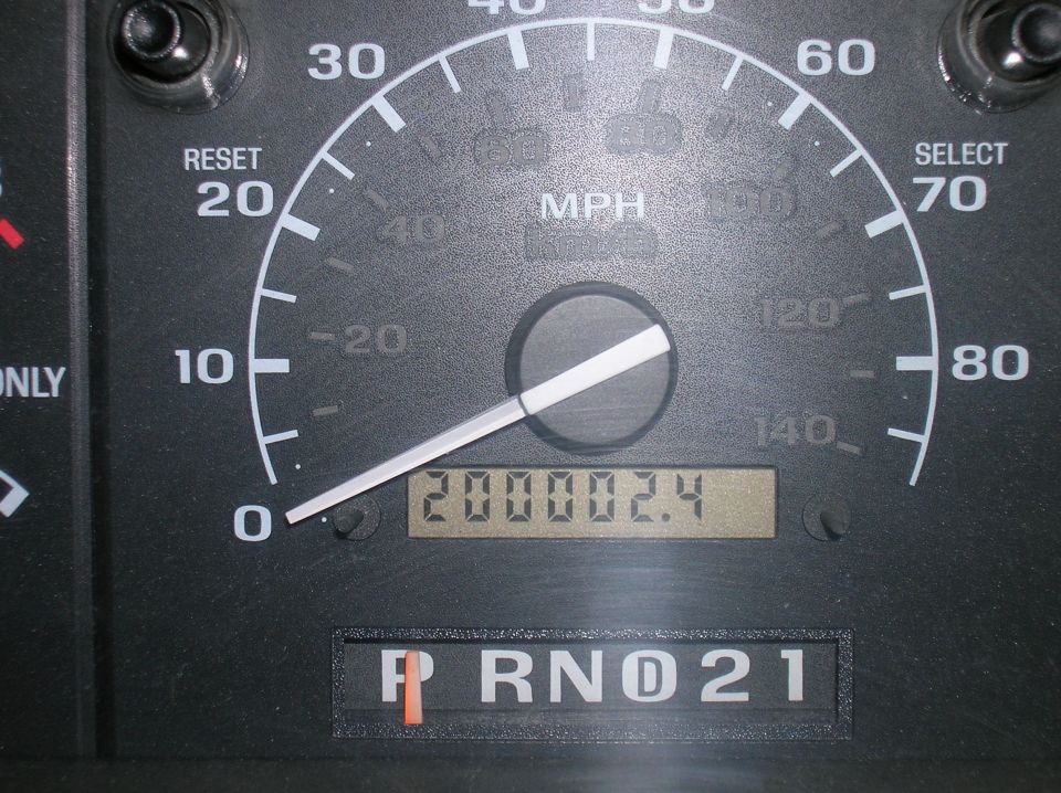Ford speedometer close-up with odometer showing 200002.4 miles and PRND21 indicator
