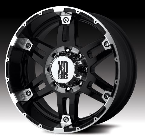 1979 Ford Bronco - A black XD Series wheel with polished accents and visible lug nut holes is shown against a gradient background.