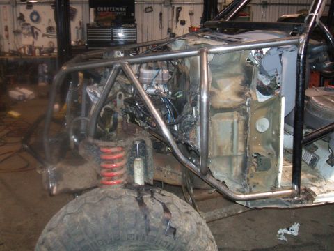 1995 Ford Bronco - This vehicle is undergoing extensive modifications, including the addition of a custom roll cage and exposed engine components.