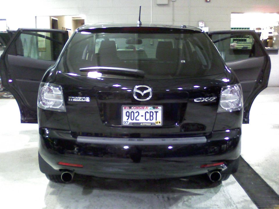 Black 2007 Mazda CX-7 SUV with rear doors open, showing a Wisconsin license plate 902-CBT