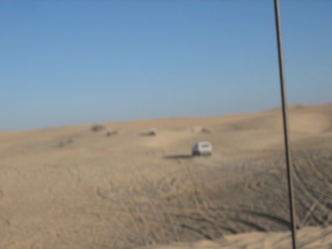 1995 Ford Bronco - A 1995 Ford Bronco navigates the sandy terrain of the dunes.