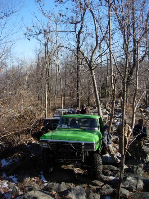 1978 Ford Bronco - Off-road adventure with a green Ford F-150 and another vehicle on a rocky trail.