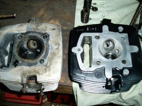 2000 Ford E350 - Two motorcycle cylinder heads are shown side-by-side for comparison, one appearing used and the other recently cleaned or rebuilt.