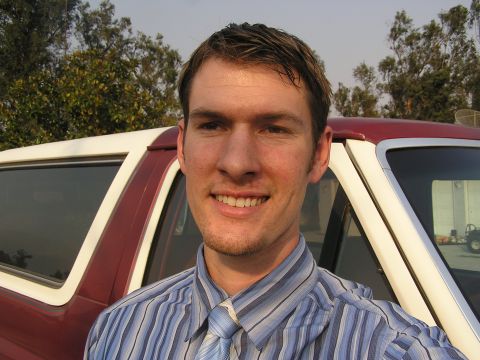 1900 Yugo GVX - Me with a stupid semi-squinty-eyed grin after work with my Bronco in the background