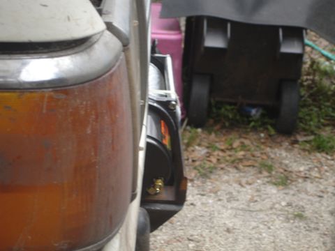 1989 Ford Bronco - A winch mount is visible on the side of a vehicle, with a rolling tool cart in the background.