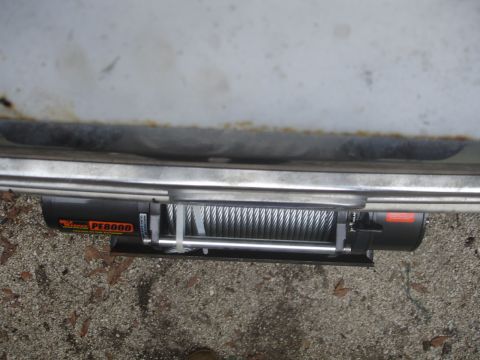 1989 Ford Bronco - A winch is mounted beneath the vehicle's bumper, showing the PE8000 model number.