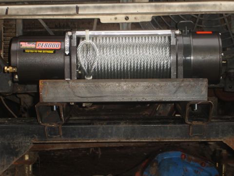 1989 Ford Bronco - Winch assembly mounted to vehicle frame, showing the PE8000 model.