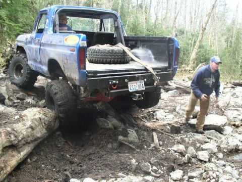 1979 Ford Bronco - This 1979 Ford Bronco is navigating a rocky, muddy trail.