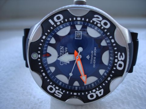 1994 Ford Bronco - Close-up of a Citizen Eco-Drive Titanium Divers 200M watch, showing the blue dial and orange accents.