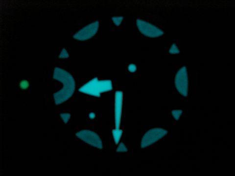 1994 Ford Bronco - Night view of a vehicle's illuminated gauge cluster with directional indicators.