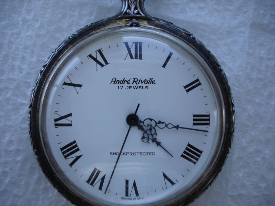 Pocket watch with Roman numerals and 'André Rivalle' branding