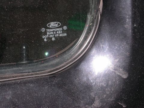 1996 Ford Bronco - Close-up of a Ford tempered glass window with manufacturer markings visible.