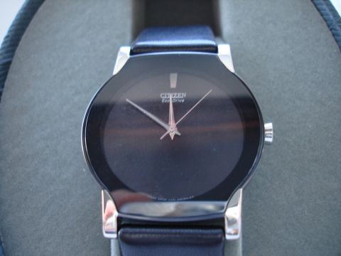 1994 Ford Bronco - Close-up of a Citizen Eco-Drive watch face with hands and brand name visible.