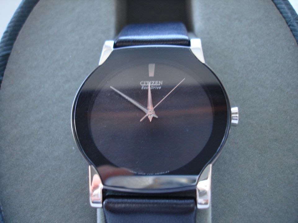 Citizen Eco-Drive watch with black face and blue leather strap