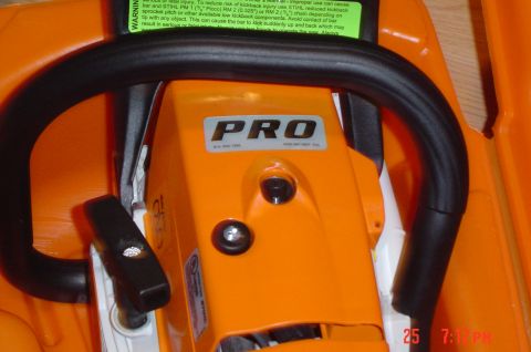 1946 Ford F1 - Close-up of an orange chainsaw's handle and engine housing, showing the 'PRO' branding.