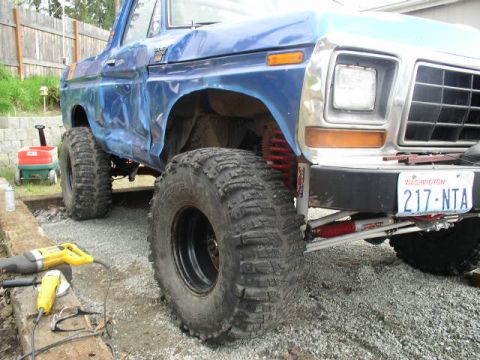 1979 Ford Bronco - This modified pickup truck features oversized tires and a lifted suspension, suggesting off-road capabilities.