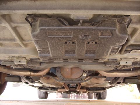 2005 Ford Crown Victoria - The underside of a 2005 Ford Crown Victoria reveals its exhaust system, rear differential, and underbody components.