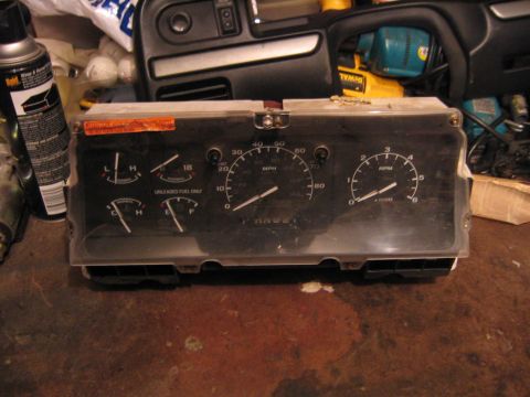 1994 Ford Bronco - Instrument cluster from a 1994 Ford Bronco, showing gauges for speed, fuel, and RPM.