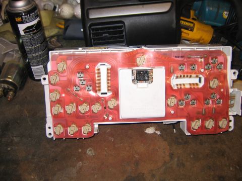 1994 Ford Bronco - The rear of a vehicle's instrument cluster shows its intricate circuitry and numerous connection points.
