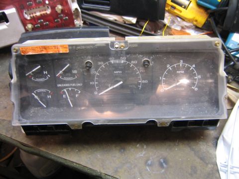 1994 Ford Bronco - This instrument cluster features a speedometer, tachometer, fuel gauge, and temperature gauge, likely from an older vehicle.