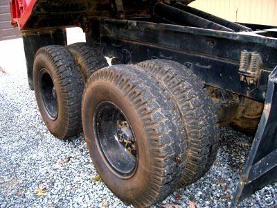 1968 Jeep CJ5 - Close-up view of the rear dual wheels and frame of a truck.
