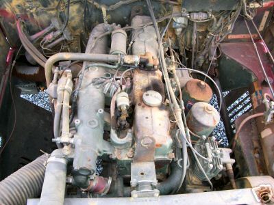 1968 Jeep CJ5 - Close-up view of an engine bay, showing complex mechanical parts and wiring.