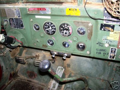 1968 Jeep CJ5 - Dashboard interior with gauges, shifter, and pedals. Text labels are present on the dash.