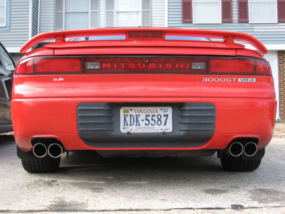 Red 1991 Mitsubishi 3000GT VR-4 rear with quad exhaust and spoiler