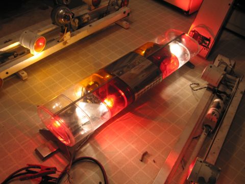 1991 Ford Crown Victoria LTD - Emergency light bar with red and amber lights, wires, and alligator clips are visible.