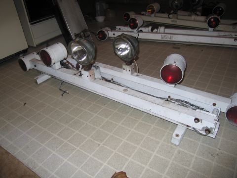 1991 Ford Crown Victoria LTD - A white light bar assembly with multiple red and clear lights is shown, likely for a police vehicle.