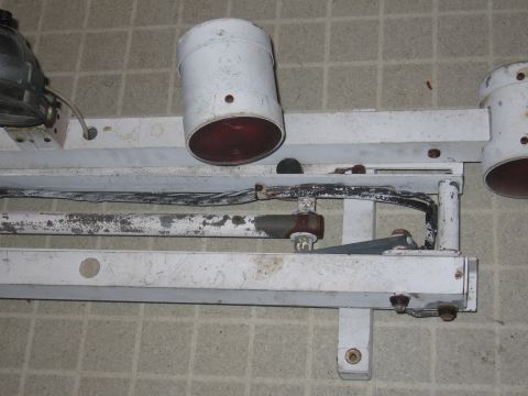 1991 Ford LTD Crown Victoria - Close-up view of a white police light bar, showing its components and wiring.