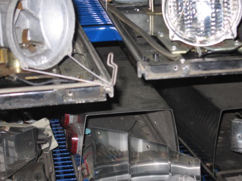 1991 Ford LTD Crown Victoria - Detail view of disassembled vehicle lighting components, showing internal wiring and mounting hardware.