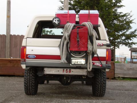 1991 Ford Bronco - Rear view of a 1991 Ford Bronco equipped for off-road use with extra fuel and storage.