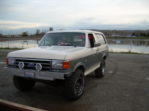 1991 Ford Bronco - This 1991 Ford Bronco features a two-tone paint scheme and an aftermarket bumper with auxiliary lights.