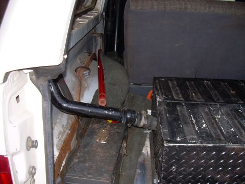 1991 Ford Bronco - This photo shows the interior of a vehicle, focusing on an auxiliary fuel tank and spare tire, not a 1991 Ford Bronco.