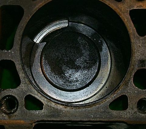 1988 Pontiac Fiero - Engine cylinder bore and piston detail, showing internal wear and carbon deposits.