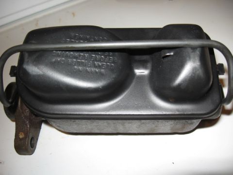 1968 Shelby GT500 - A brake master cylinder with warning text visible on its reservoir cap.