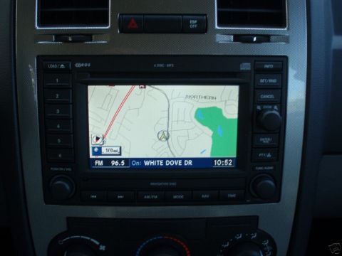 2007 Chrysler 300 - Interior view of a car's dashboard, focusing on the infotainment system with GPS and radio display.
