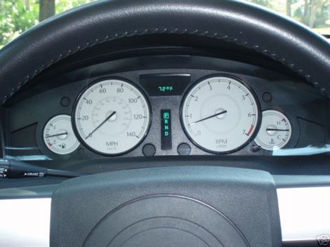 2007 Chrysler 300 - Interior view of a 2007 Chrysler 300 dashboard, showing the speedometer, tachometer, and other gauges.