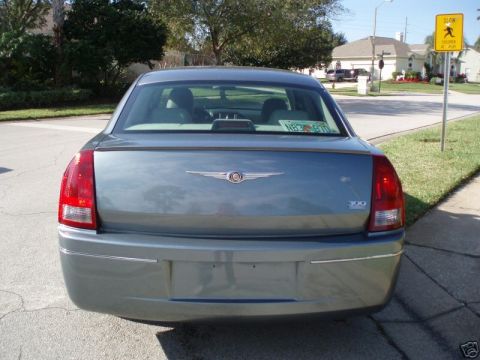 2007 Chrysler 300 - Rear view of a blue 2007 Chrysler 300 sedan, showing its distinctive taillights and chrome badging.