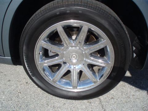 2007 Chrysler 300 - A close-up shot focuses on the chrome wheel and tire of a vehicle.