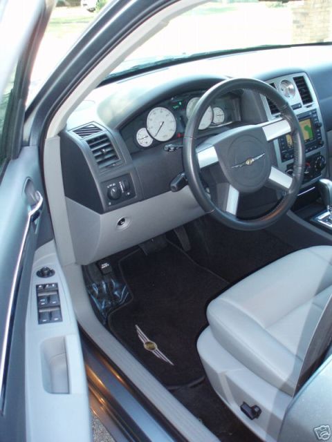 2007 Chrysler 300 - Interior view of a car showing the driver's seat, dashboard, and steering wheel.