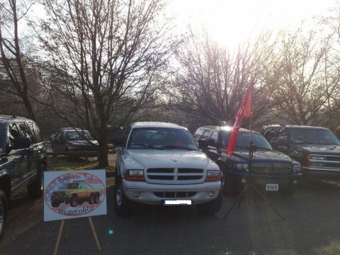 1991 Ford Crown Victoria - White Dodge Dakota pickup truck is parked at an outdoor event with other vehicles.