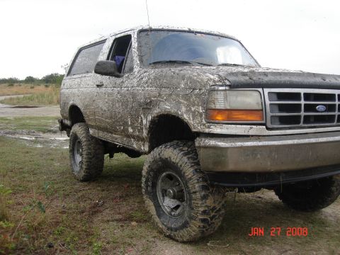 2001 Ford F-150 - This mud-covered SUV, likely a 1992 Ford Bronco, is shown in a 3/4 front view. The date stamp indicates it was photographed on January 27,…