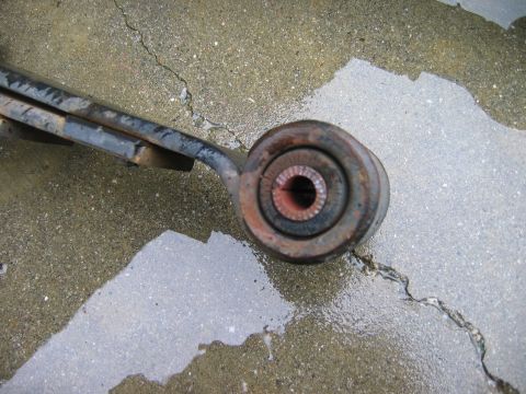 1983 Ferrari Enzo - A close-up view of a worn suspension part, not a 1983 Ferrari Enzo.