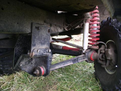 1979 Ford Bronco - Detailed view of the suspension system on a vehicle, showing the springs and shocks.